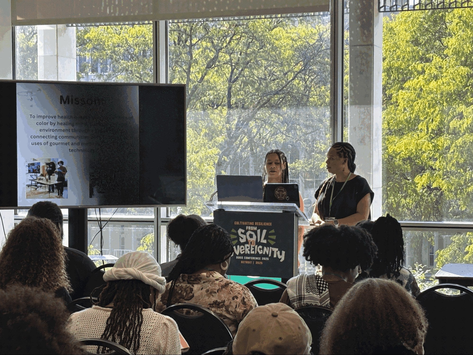 Jasmine Barber and Dennise Mofidi presenting at the BUGS Conference 2025 Soil Sovereignty panel in Detroit